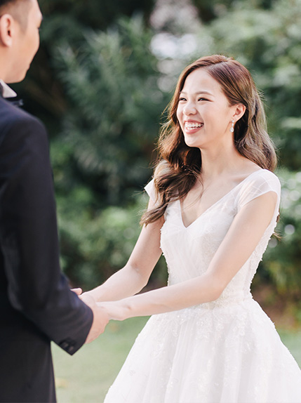 bride laughing during wedding ceremony
