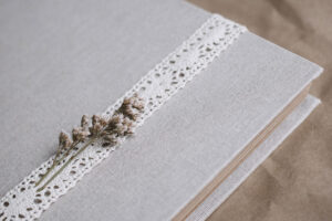 photo of wedding album with floral and lace details